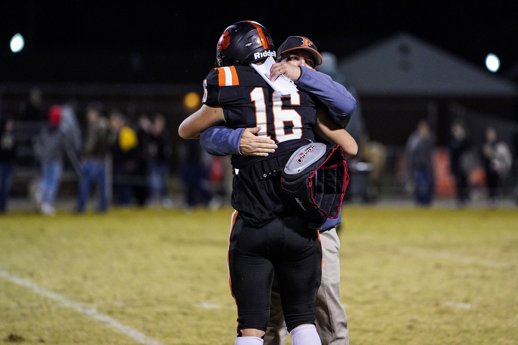 DSC05260 - FHS Coach Kenny Morson congratulates QB Sam Holdmeyer after the win.jpg